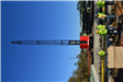 Crane preparing to position bridge support beams