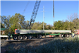 Truck in position with bridge support beams