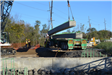 Bridge support beam being hoisted by the crane