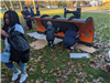 Side Angle View of Students Painting the Plow