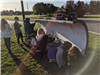 Straight View of Students Painting the Plow