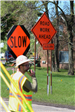Construction Flagger with Road Work Sign