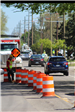 Construction Flagger Directing Traffic on Dequindre Road