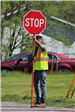 Construction Flagger Directing Traffic on Dequindre Road