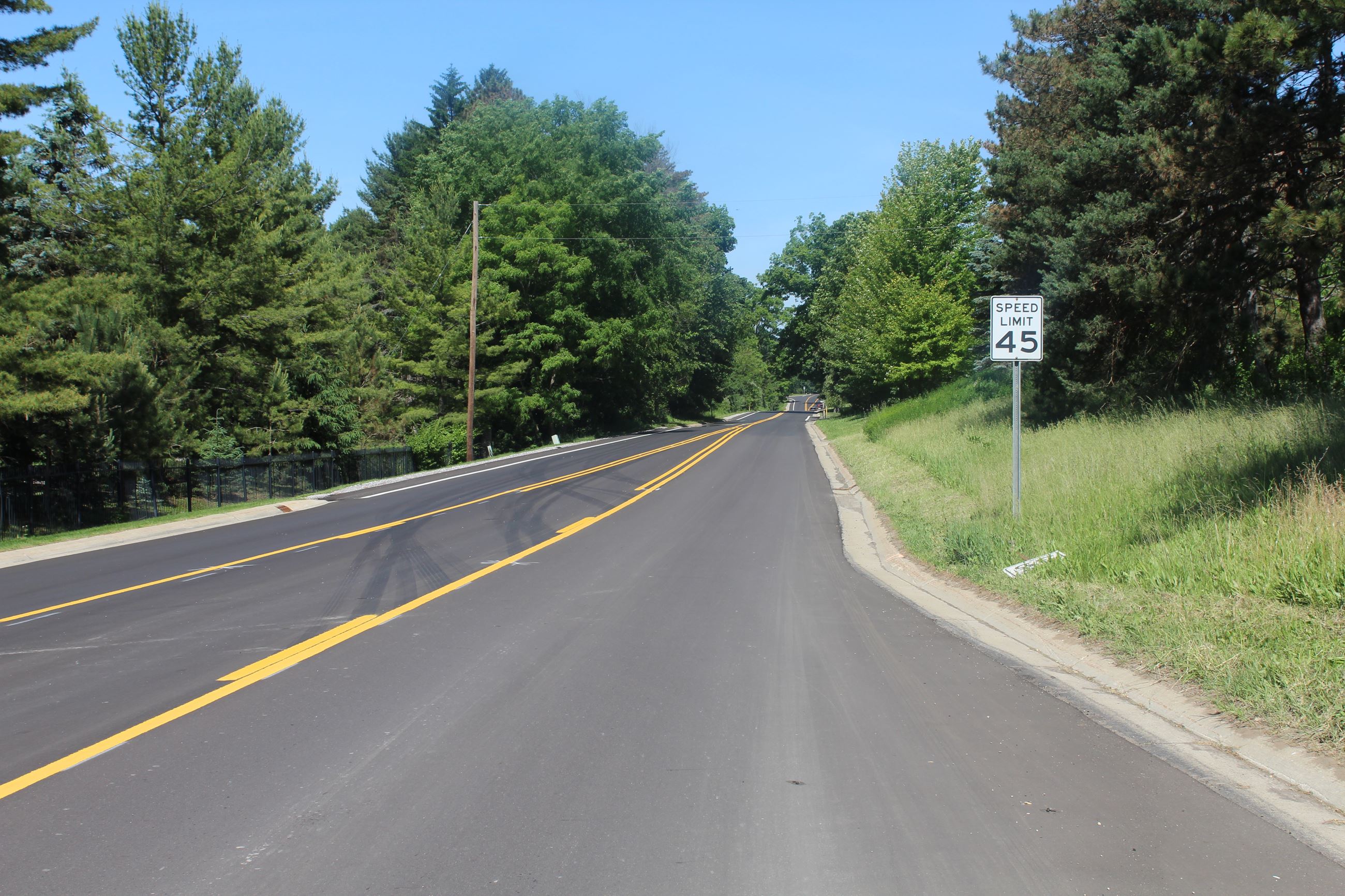Resurfaced Holcomb Road in Independence Township, looking west