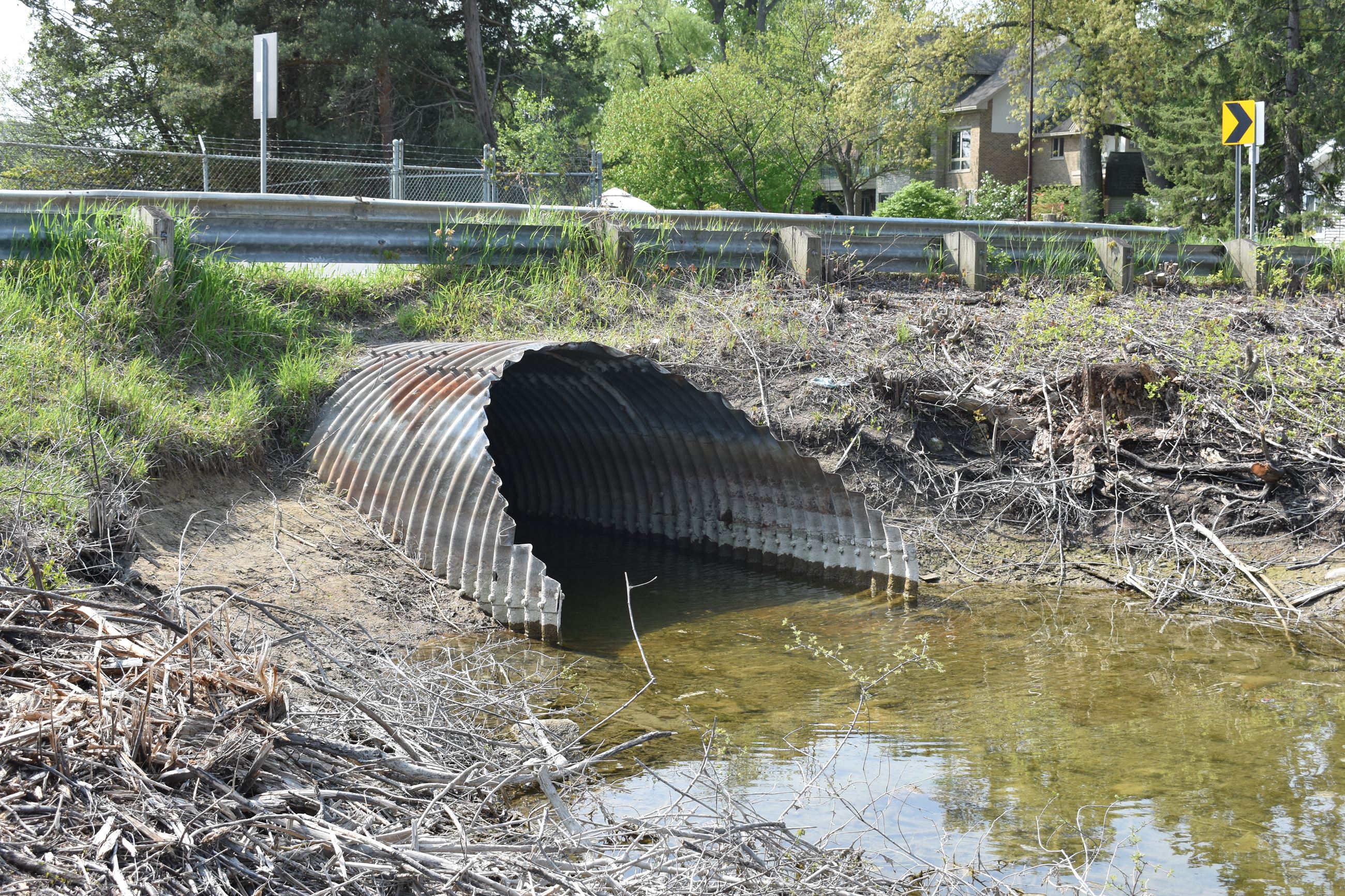 Oxbow Lake Road culvert pre-construction photo (west side of Oxbow Lake Road) metal culvert