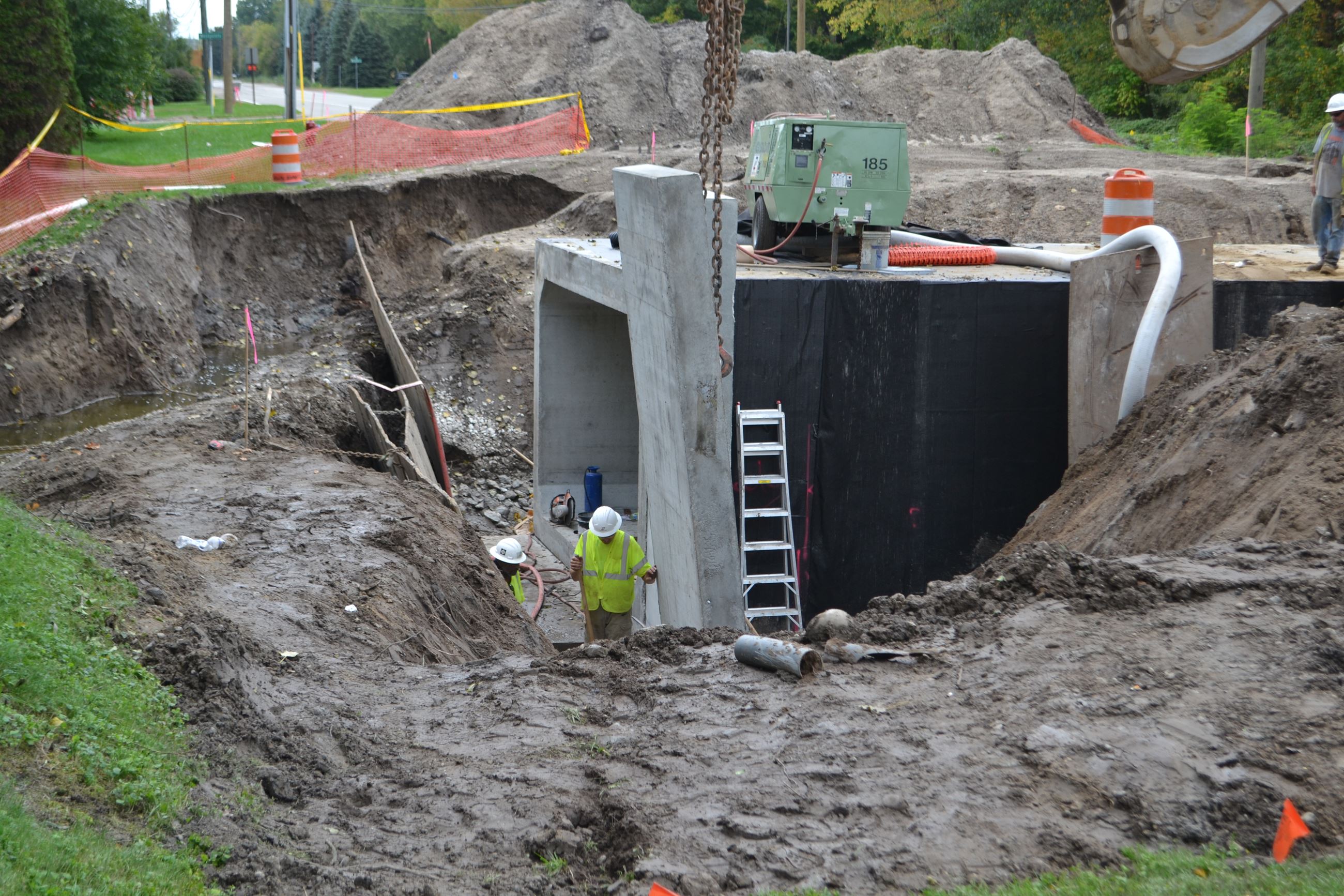 Wing wall being positioned into exact location