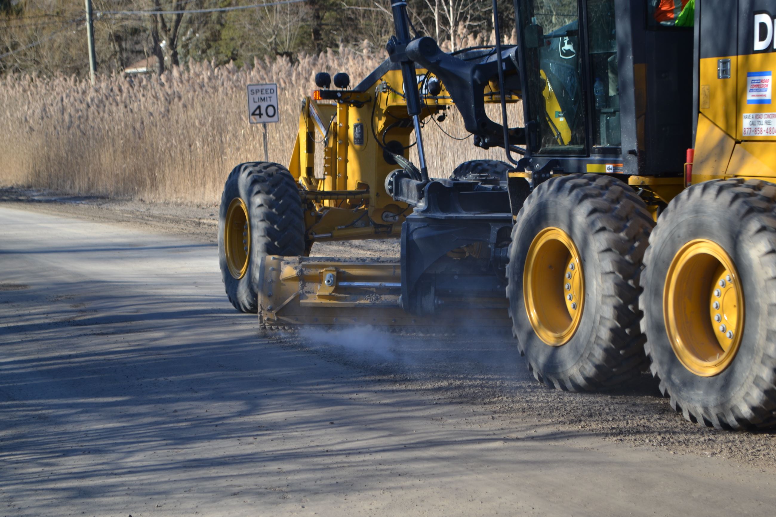 View of a Grader Grading From Behind and to the Left Side