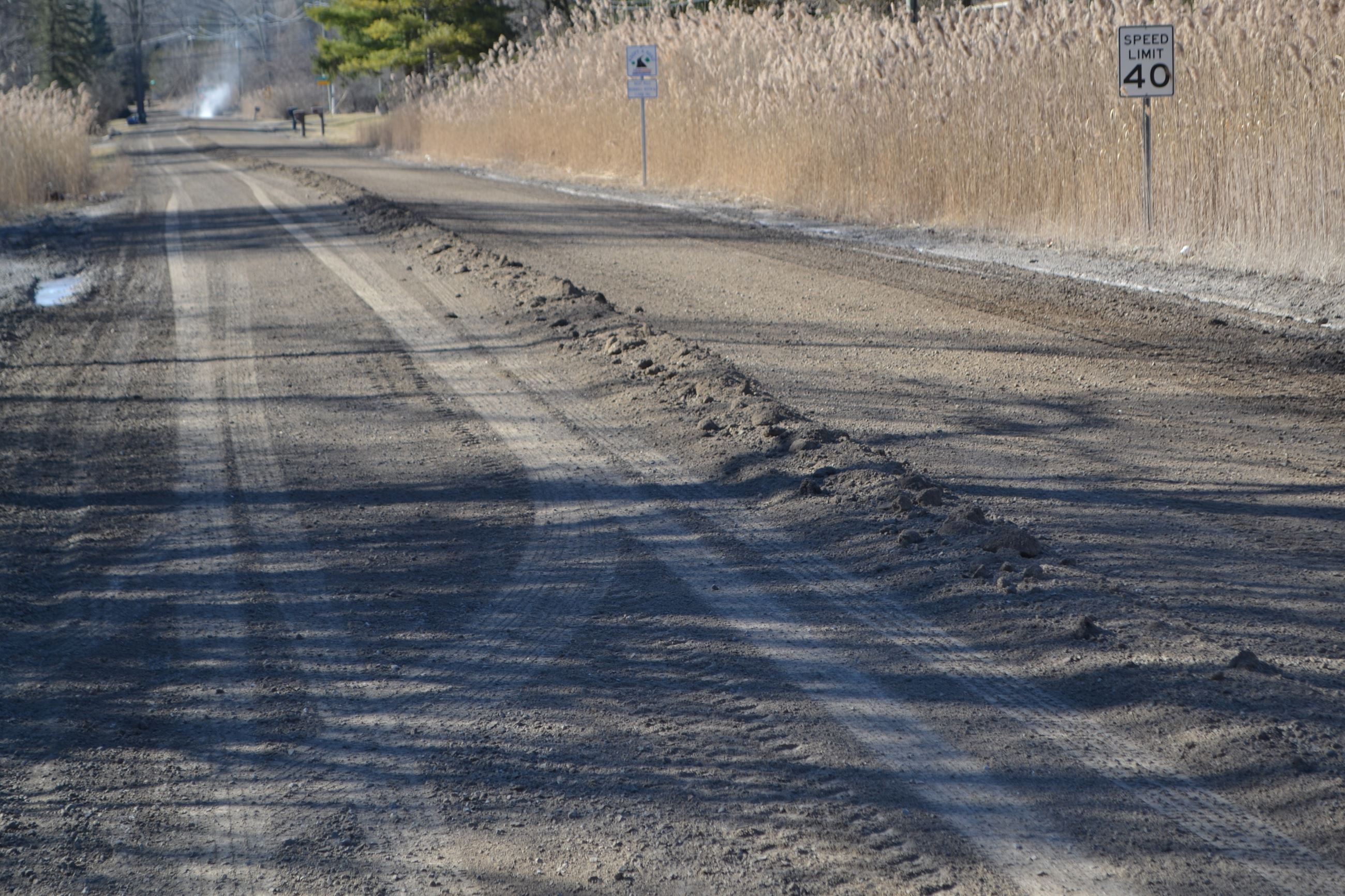 Dirt Pile Grader Has Pulled to Build up the Crown of a Gravel Road