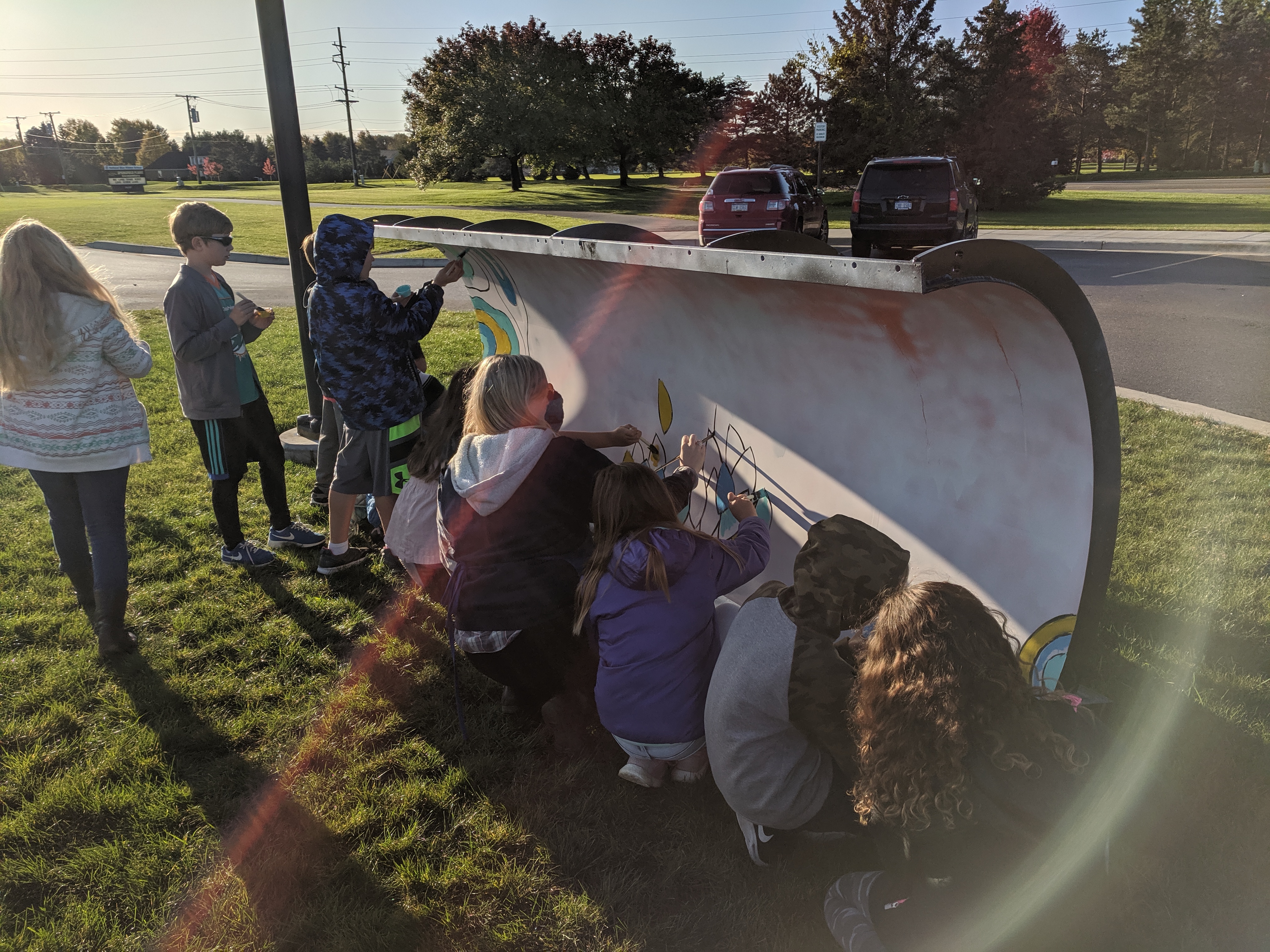 Straight View of Students Painting the Plow