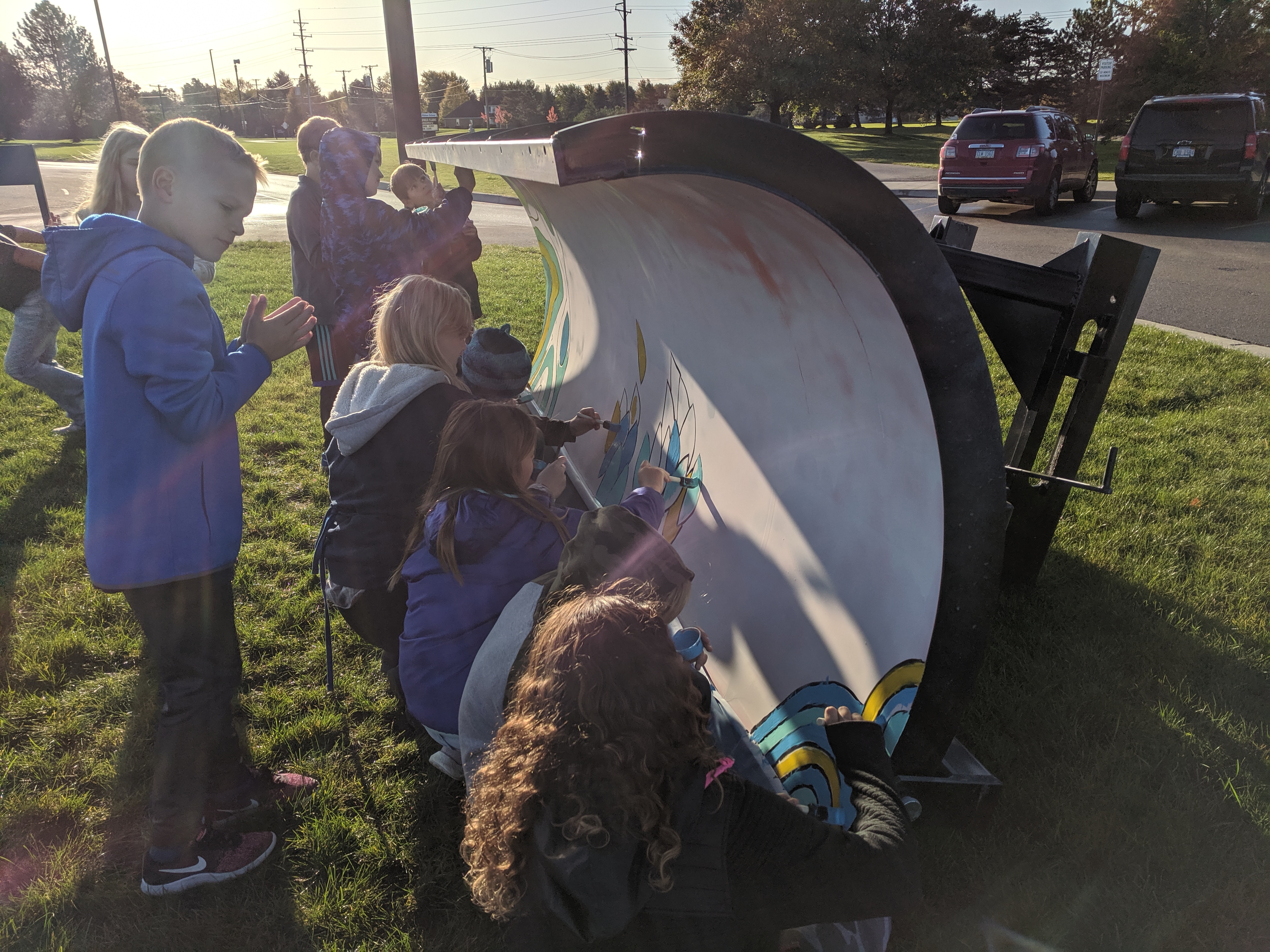Multiple Students Painting a Plow
