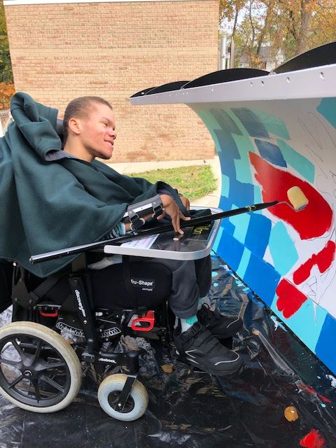 Student with a Roller Painting a Plow