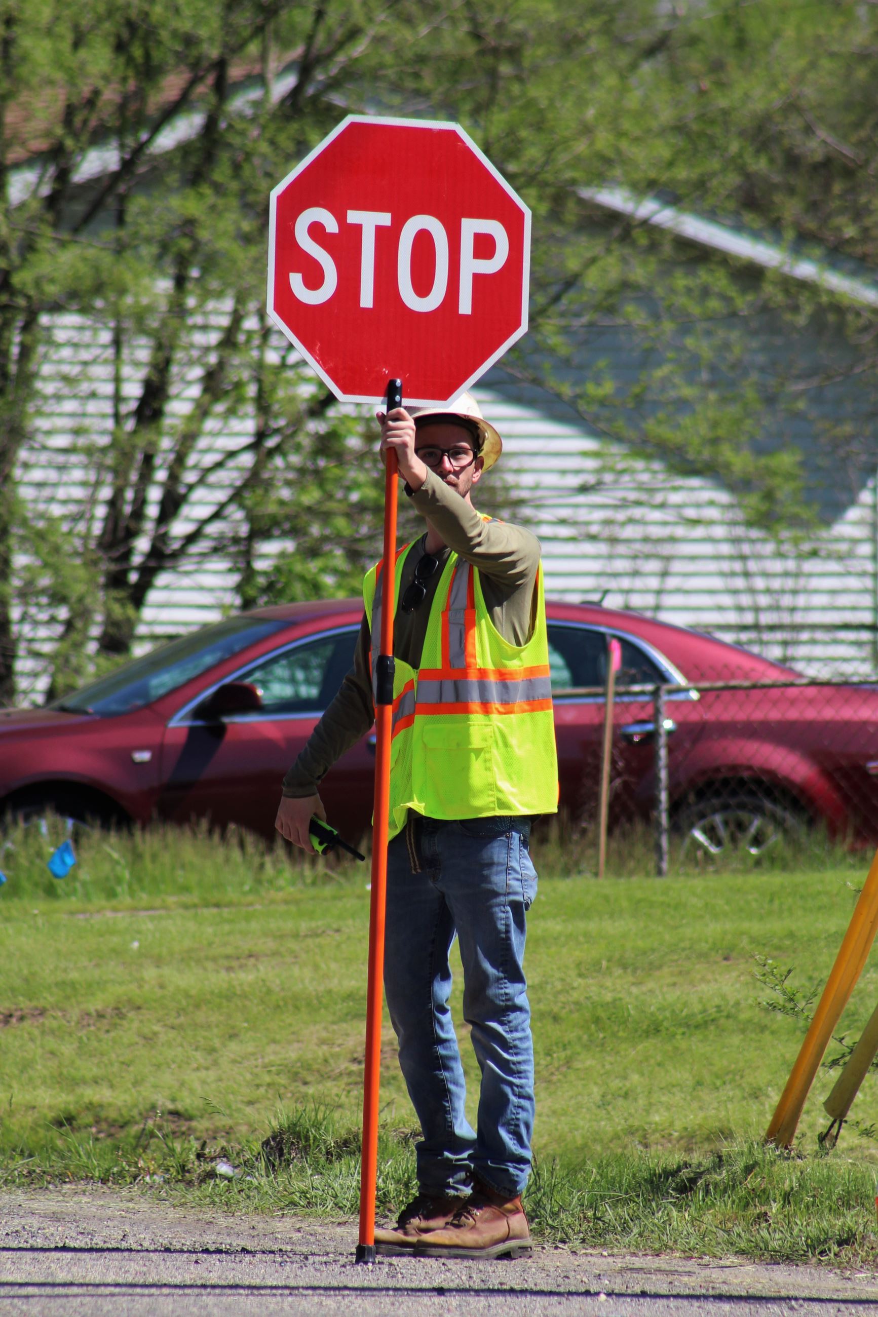 Construction Flagger Directing Traffic on Dequindre Road