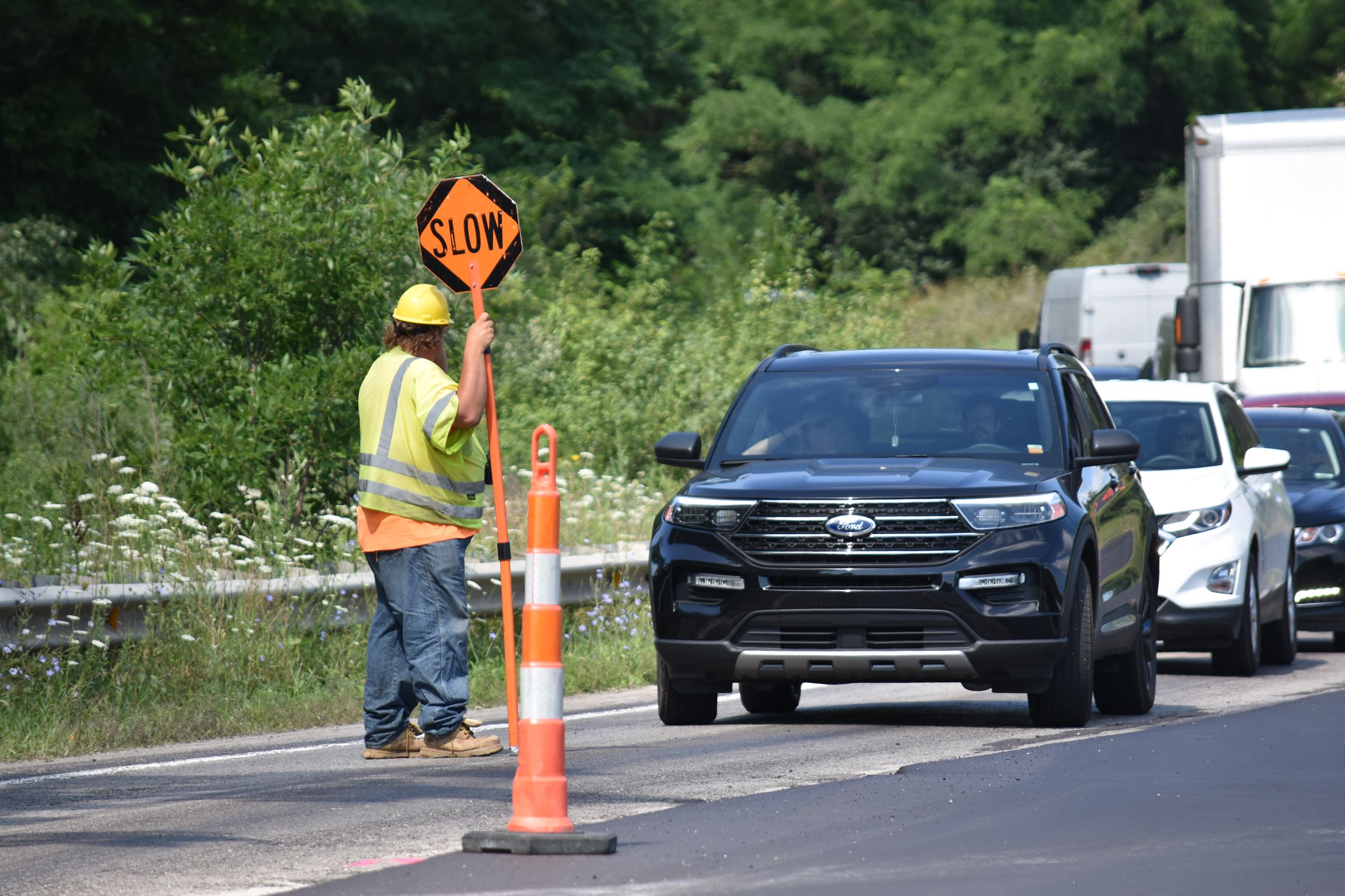 White Lake Road west of Andersonville, flagman directing traffic 
