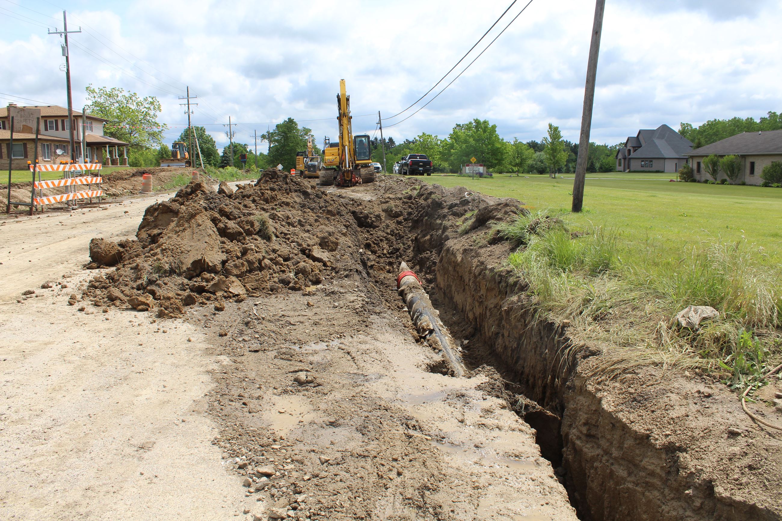 Utility work being done at the 8 Mile and Currie Road intersection pre roundabout construction