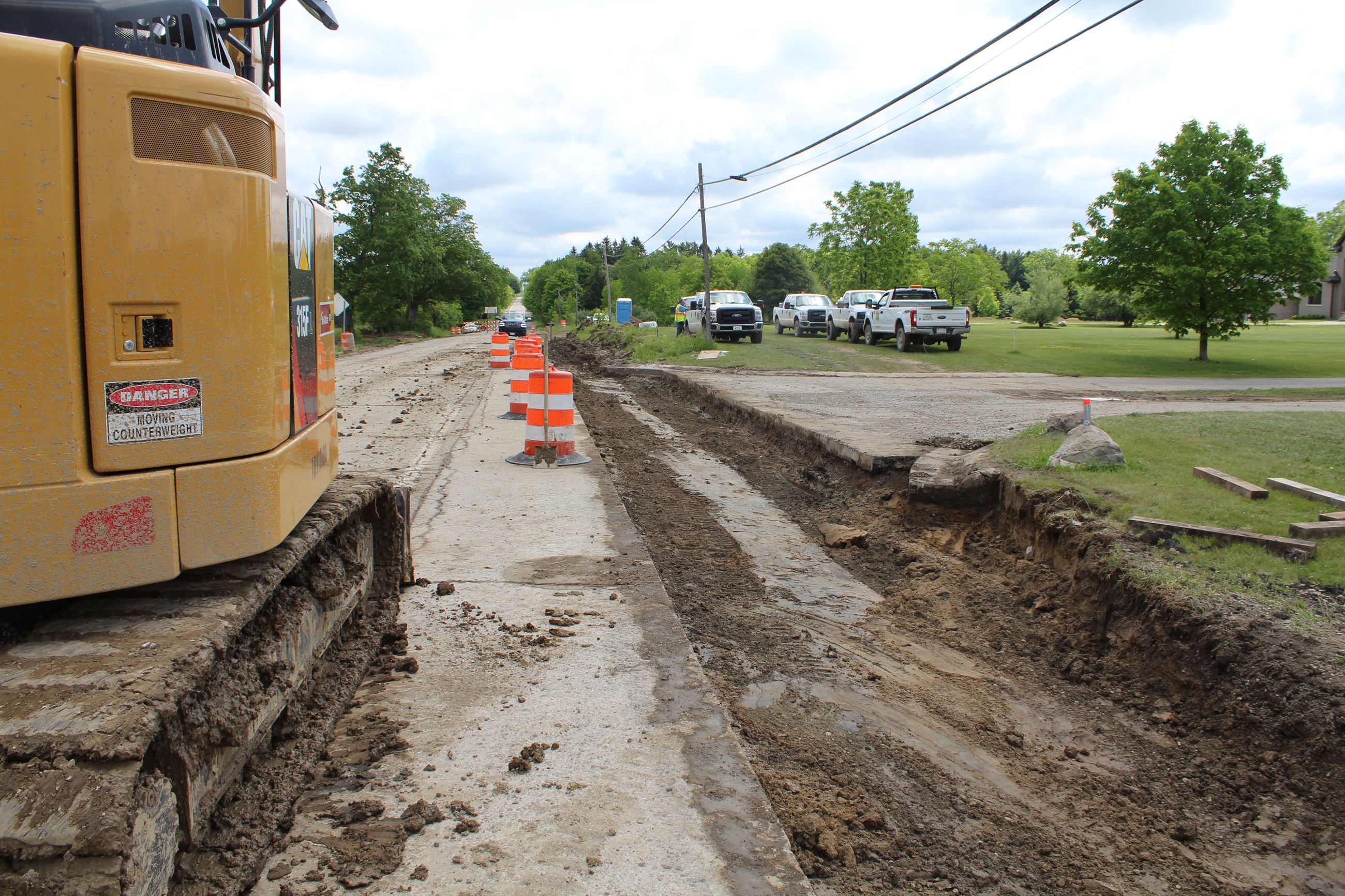 Preparing to remove old utility lines at the 8 Mile Currie Road intersection pre construction.