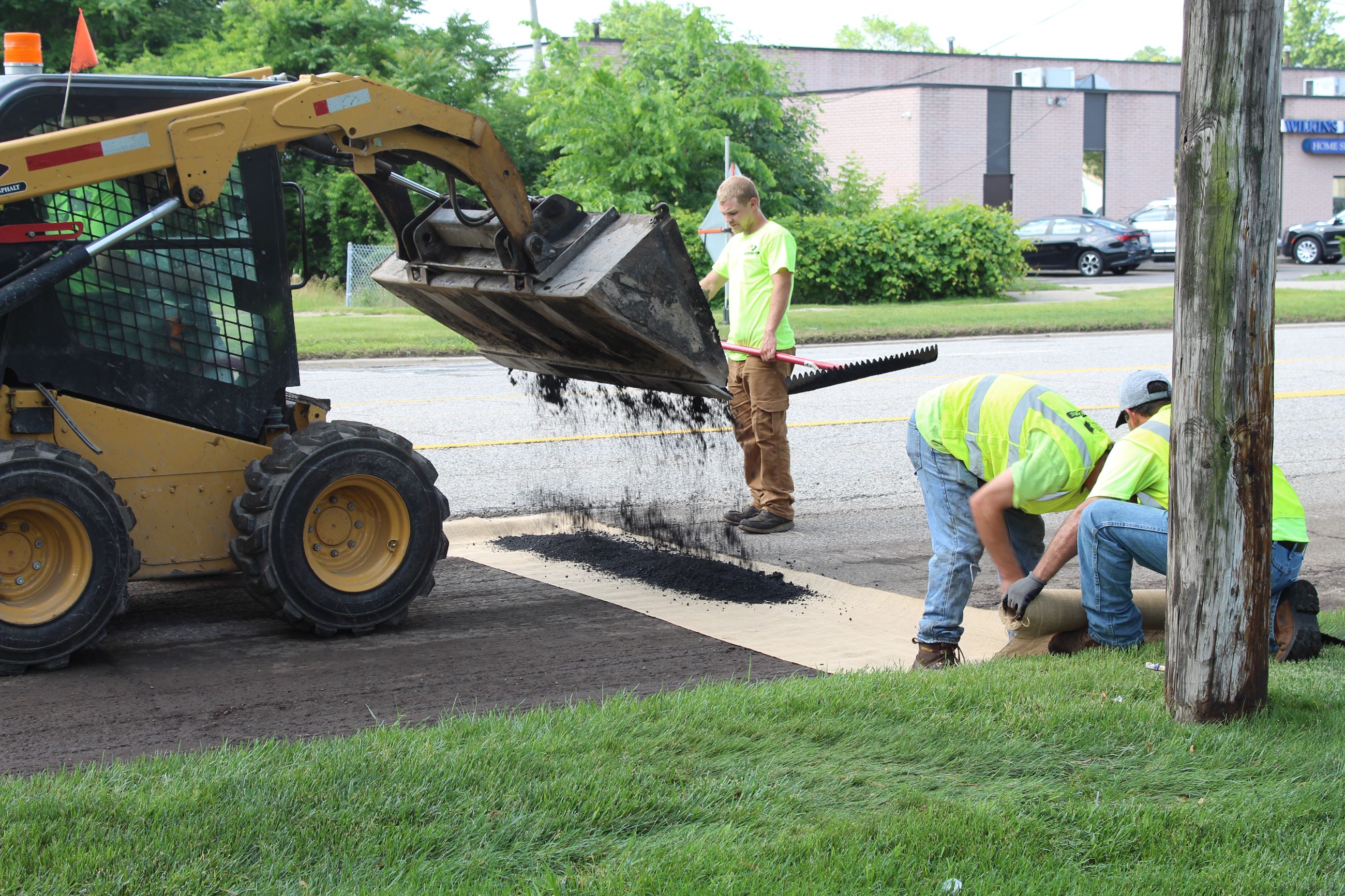 Preparing to pave 8 Mile Road spot resurfacing sections just west of Tuck Road