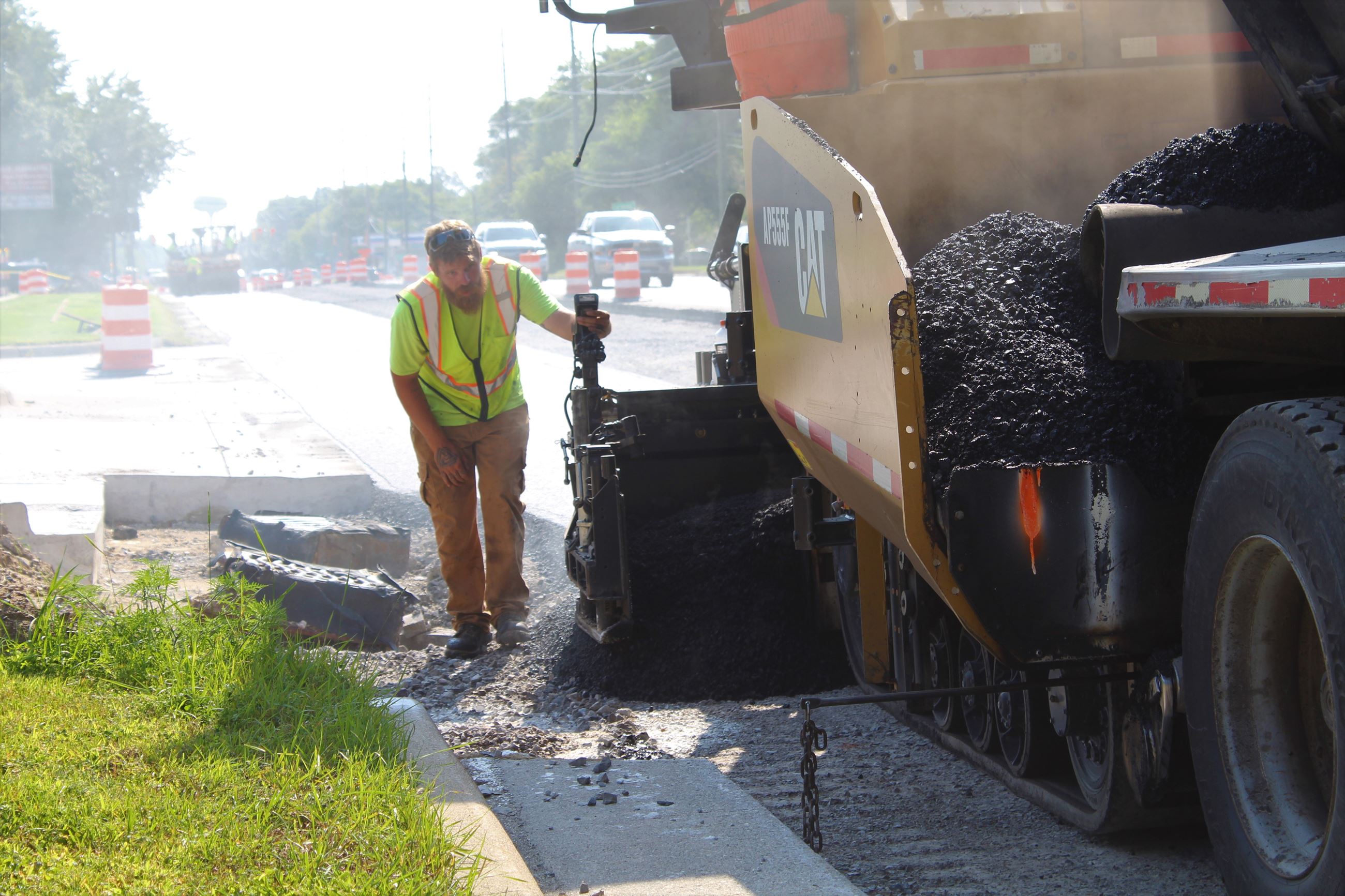 Lining up the paver with new curbs on Walton Blvd. between Sashabw Rd. and Dixie Hwy. in Waterford Township