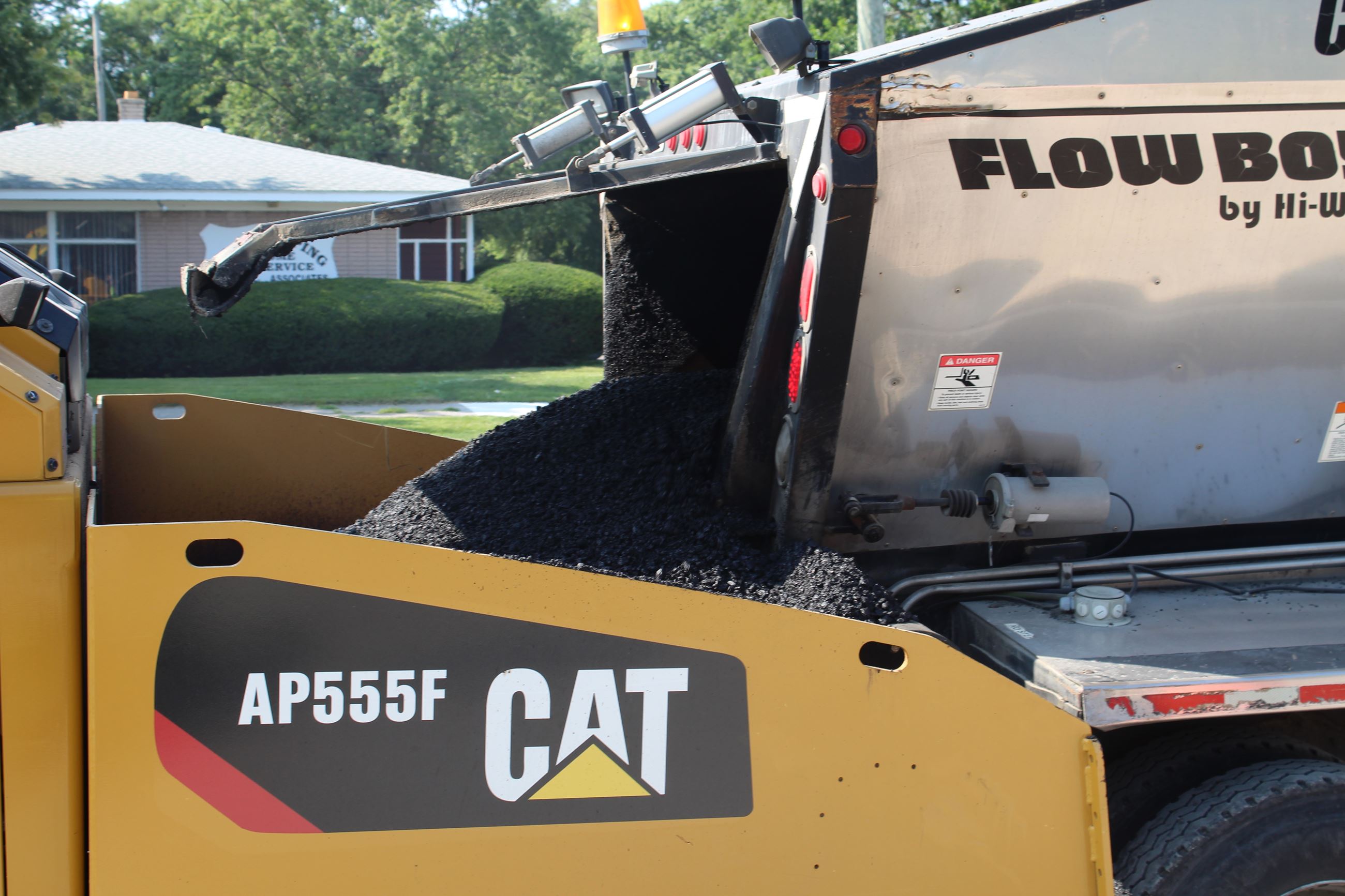 Hot mix asphalt being dumped into paver on Walton Blvd. between Sashabaw Rd. and Dixie Hwy. in Waterford Township