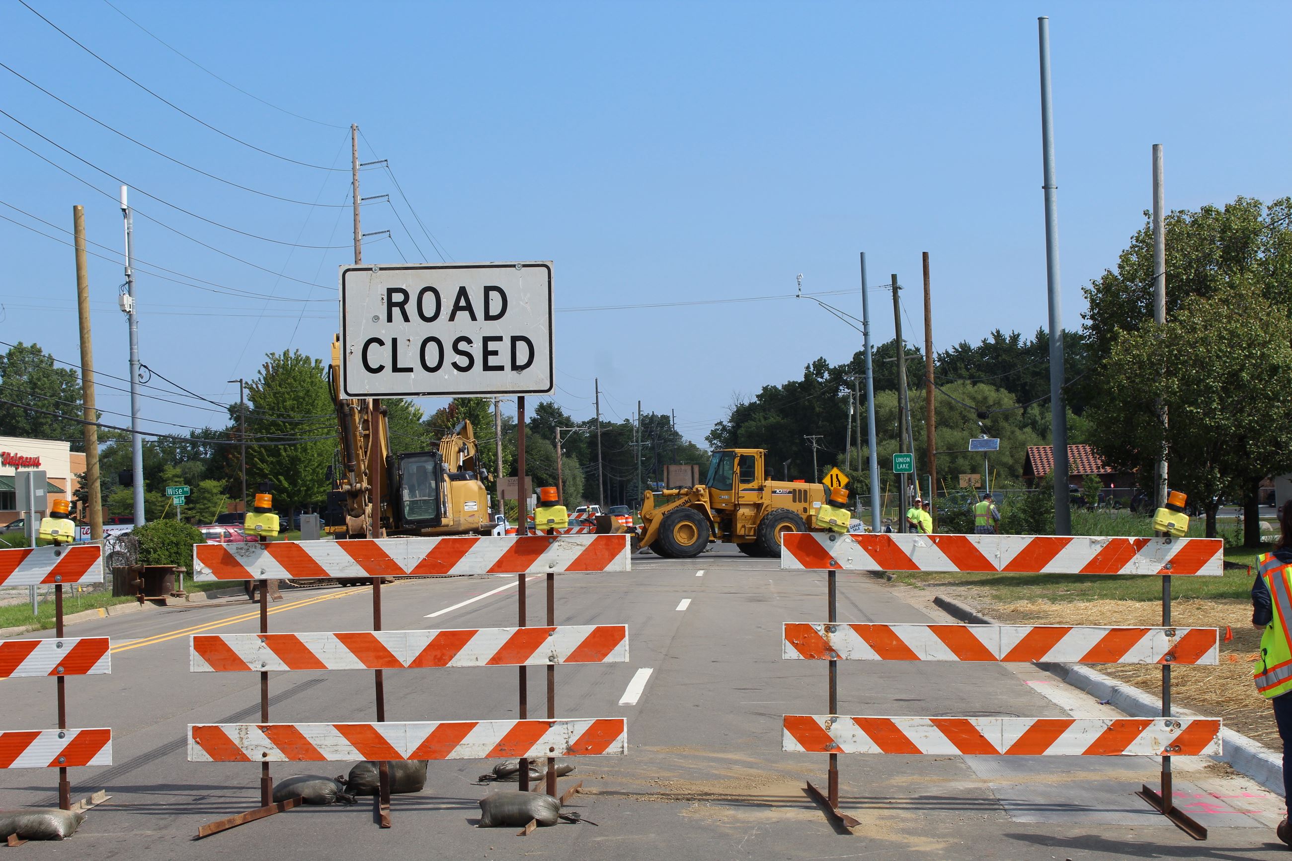 Road closed sign on Union Lake Rd. with project area in background
