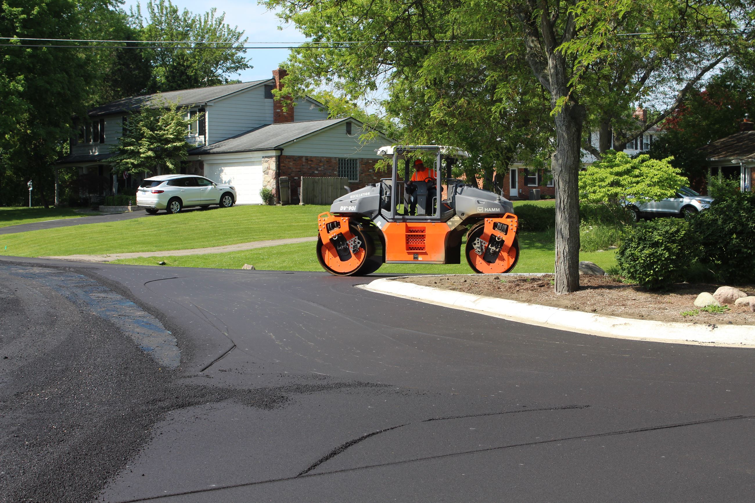 Roller on freshly laid asphalt on Sutters Ln. in the Kirkwood SAD district in Bloomfield Township